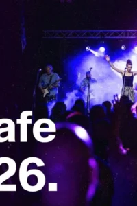 Poster for St. Martin’s Day with Gustafi at Pogon, showing the band onstage under purple and blue lights, an audience in the foreground, and the date 11.11.26.
